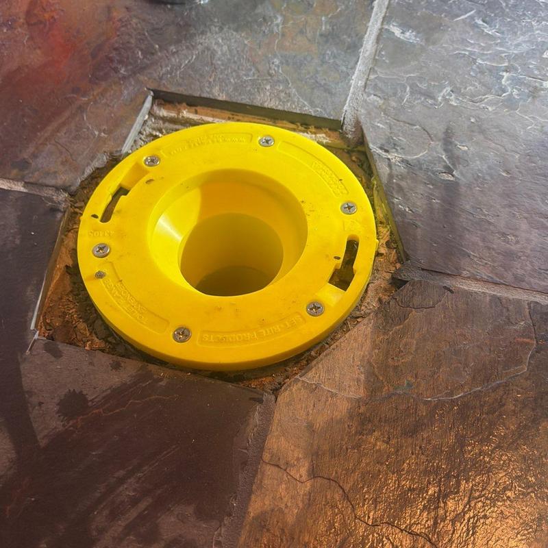 Toilet flange with raised riser in tile floor Toilet flange with raised riser in tile floor