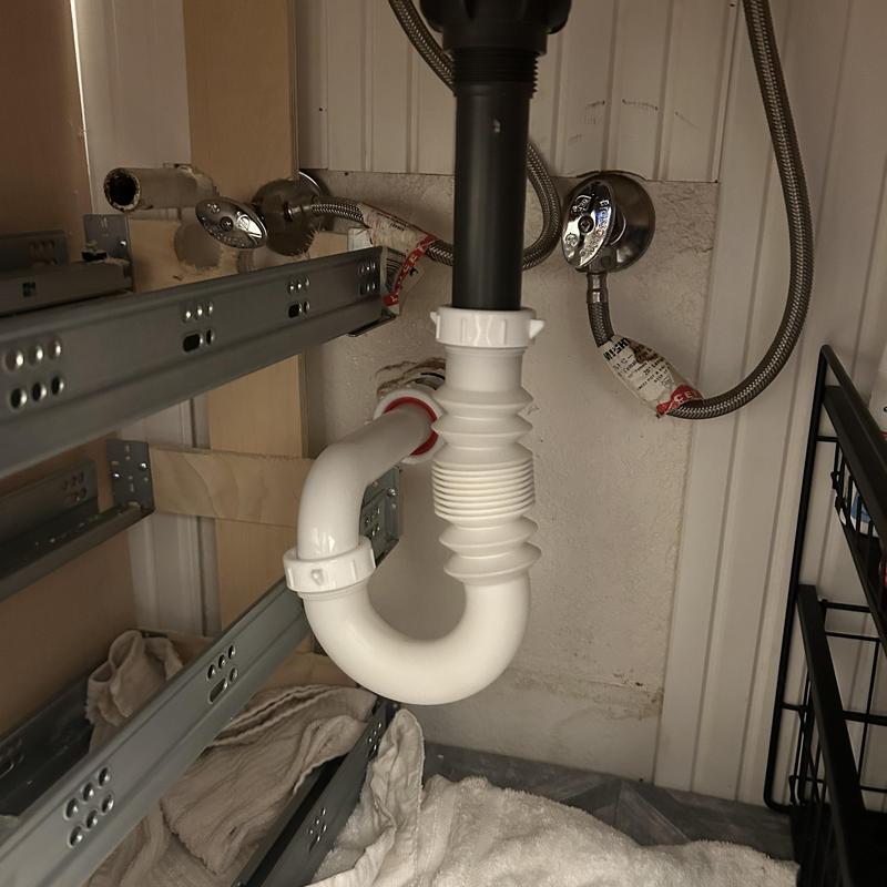 P-trap and tubular T drain line connection under sink