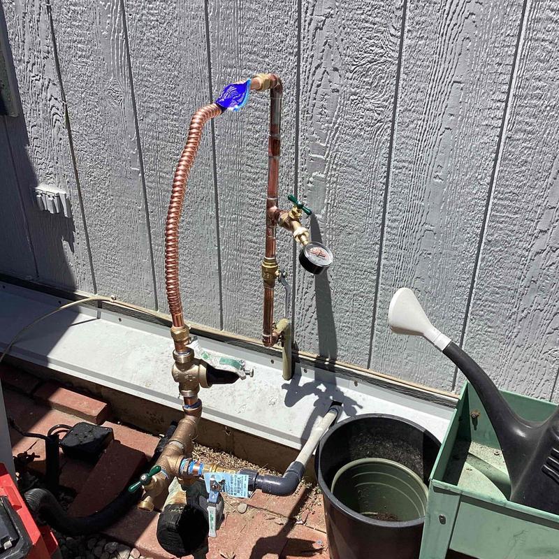 34 water main riser with valves and pressure gauge outdoors