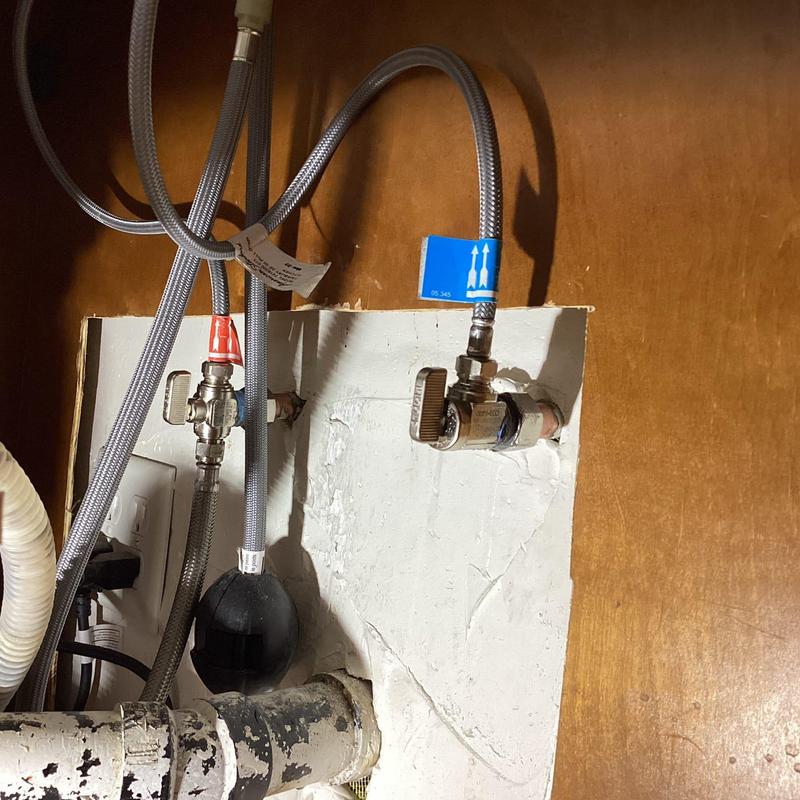 Braided hot and cold angle stop valves under sink