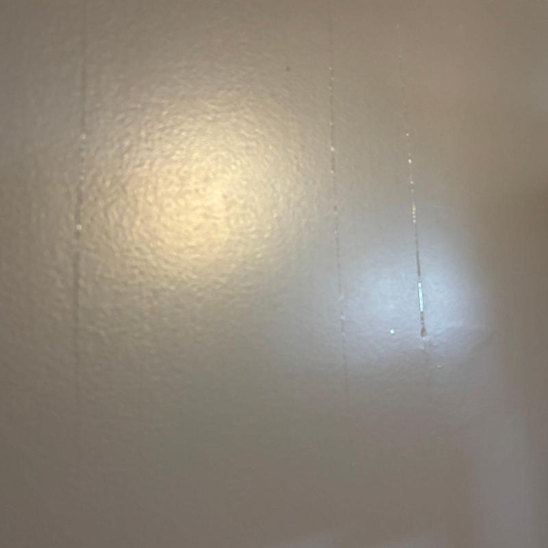 Interior wall paint streaks from moisture damage