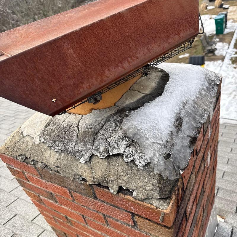Chimney crown with severe cracking and rusted cap