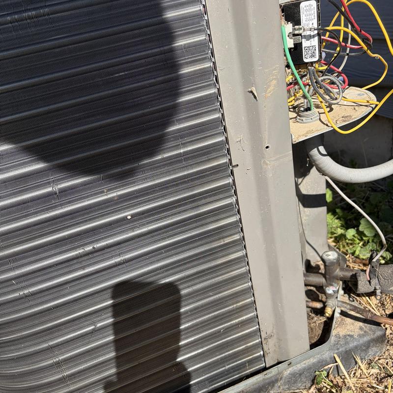 AC outdoor coil with wiring and refrigerant lines