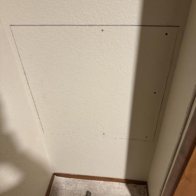 Drywall patch installed after shower valve replacement