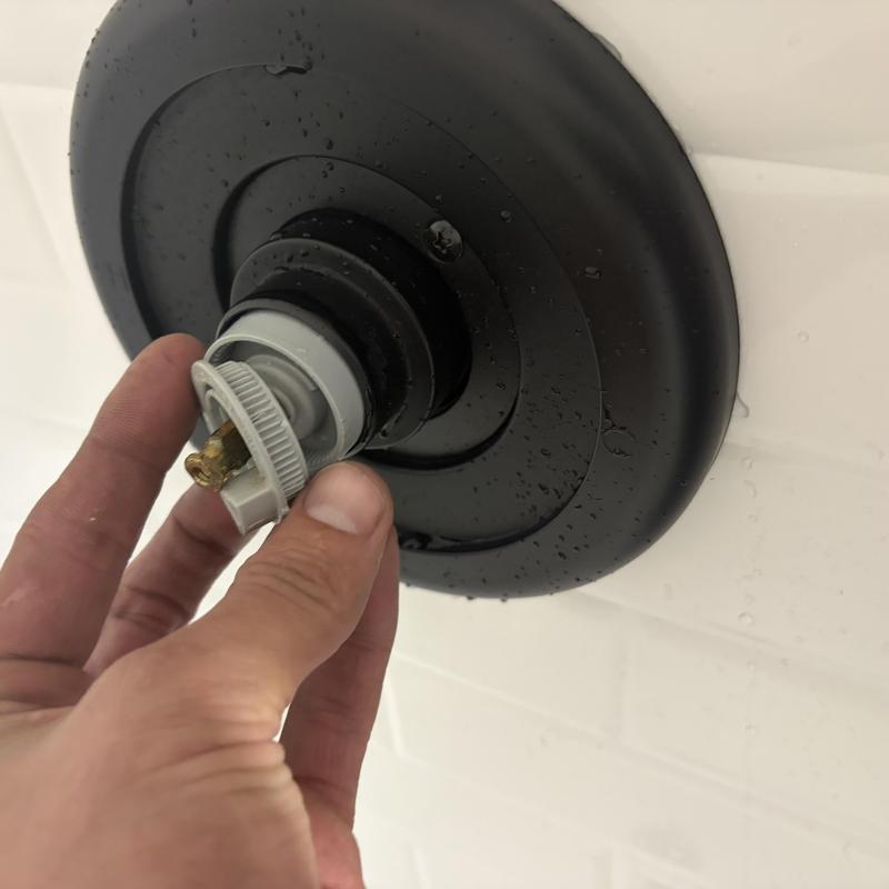 Shower valve handle adapter being replaced and adjusted