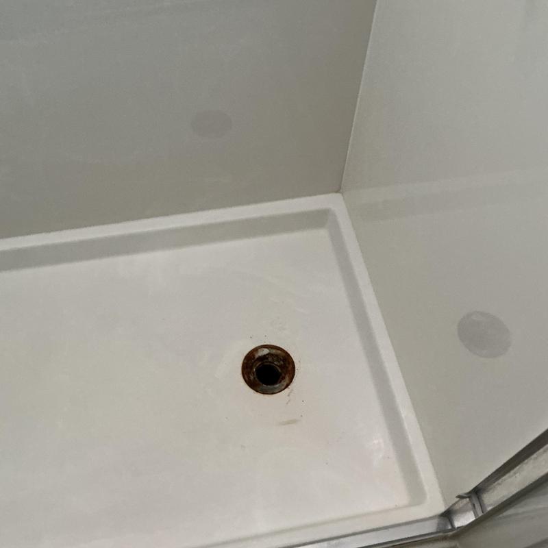 Shower drain flange with rust and discoloration