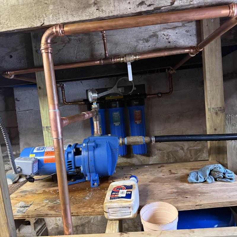 Water filter system with pump and copper piping installation Water filter system with pump and copper piping installation