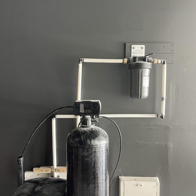 Water softener system with filtration loop installed