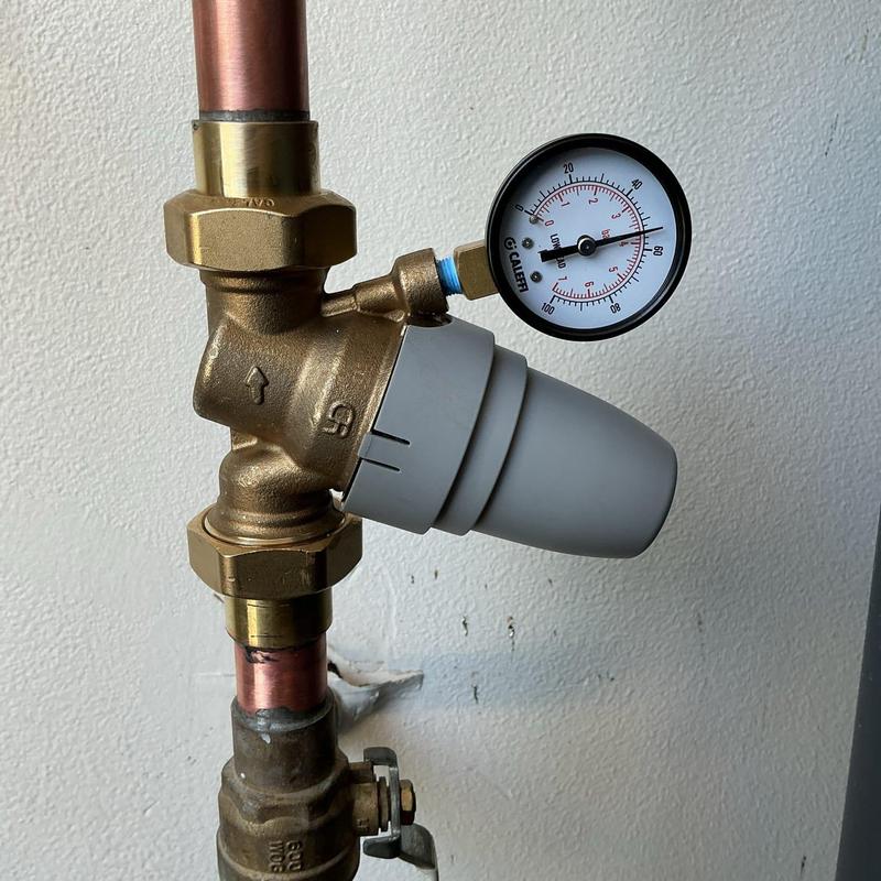 1-inch pressure regulator with gauge on copper pipe