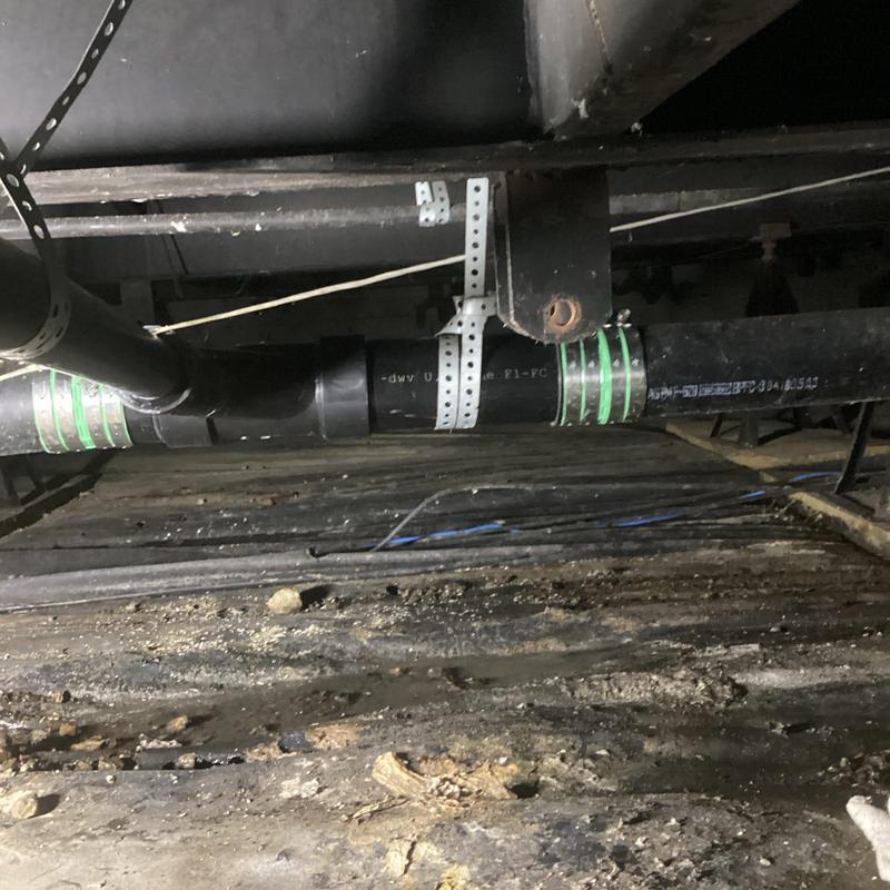 Island sink ABS drain piping with metal supports