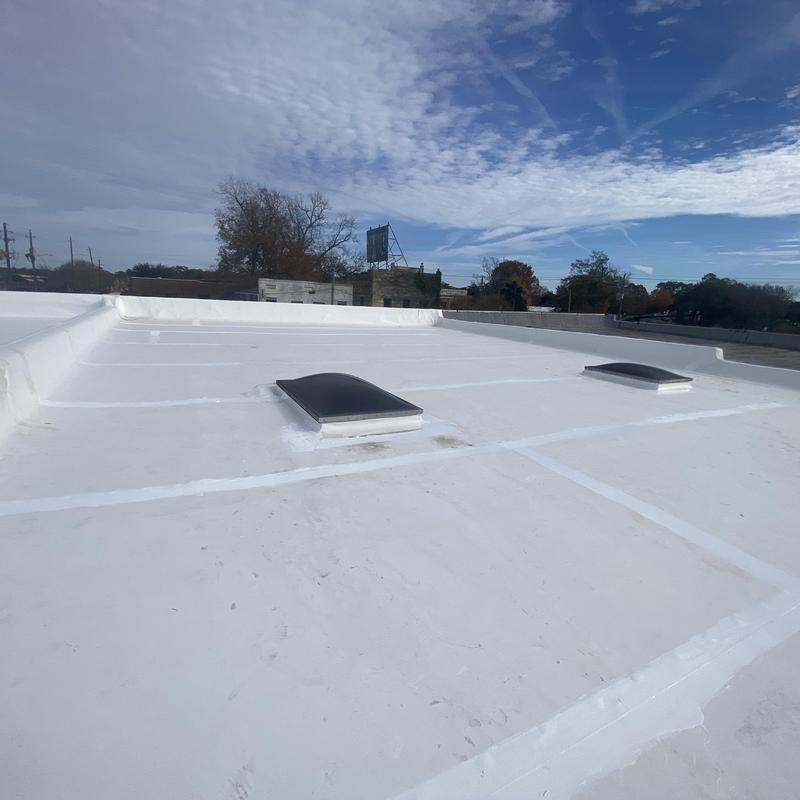 TPO flat roof system with skylights on commercial building TPO flat roof system with skylights on commercial building