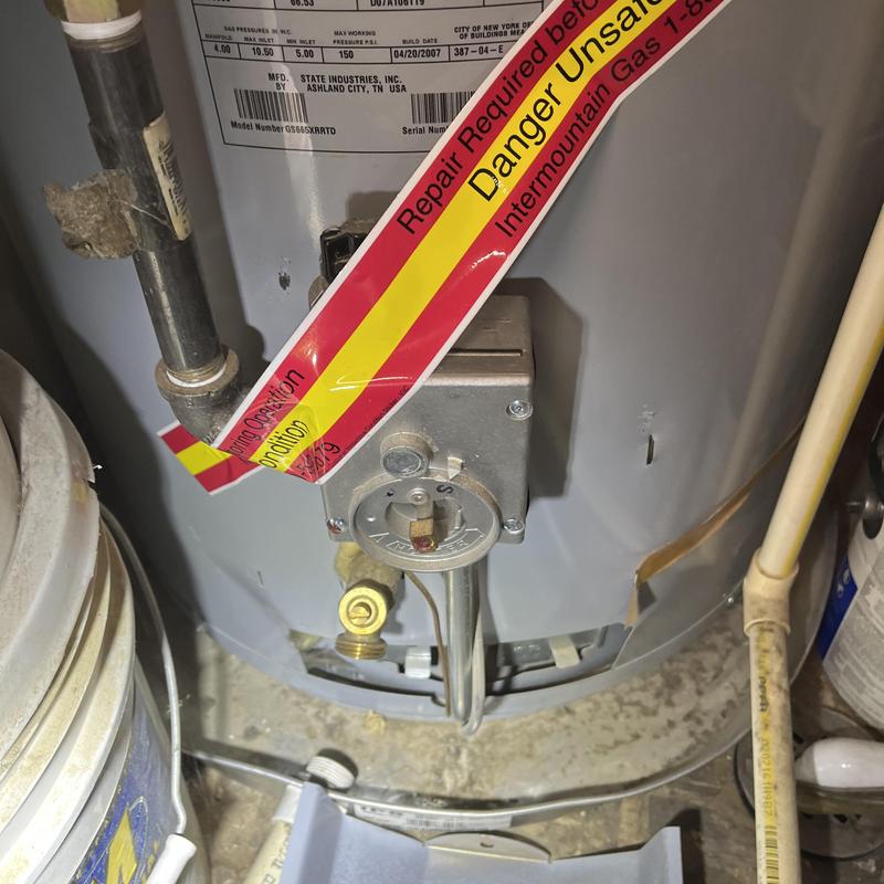 50 gallon gas water heater with danger warning tag