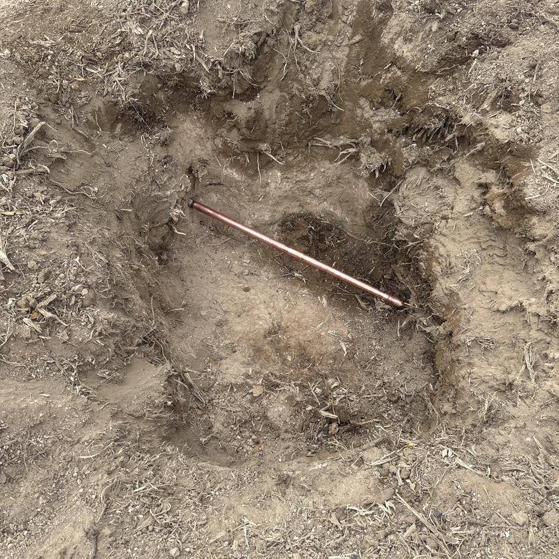 1 inch copper water line in dirt excavation site