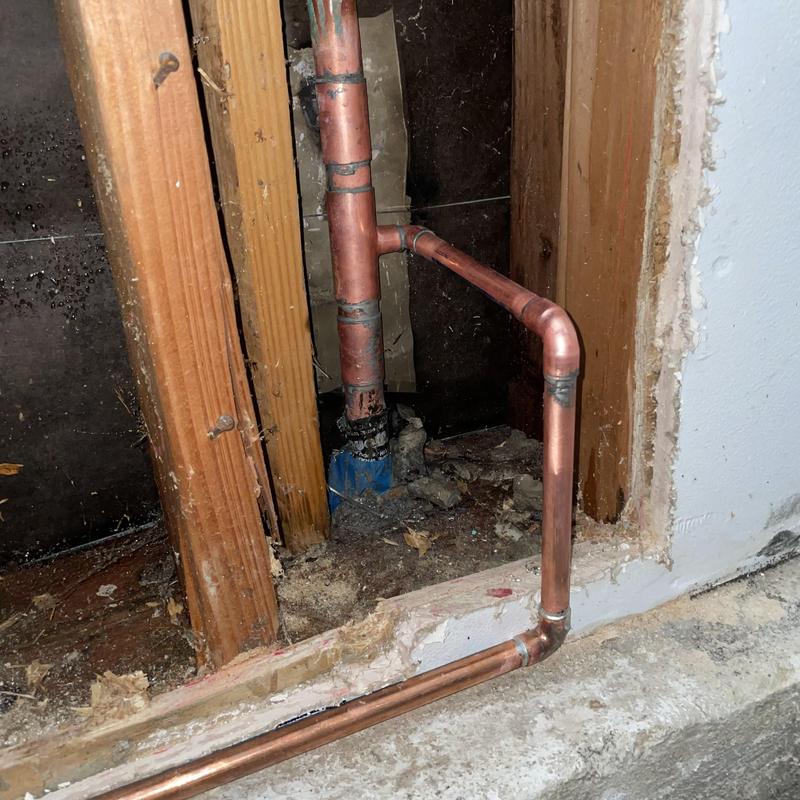 Type L copper water supply piping installation near slab