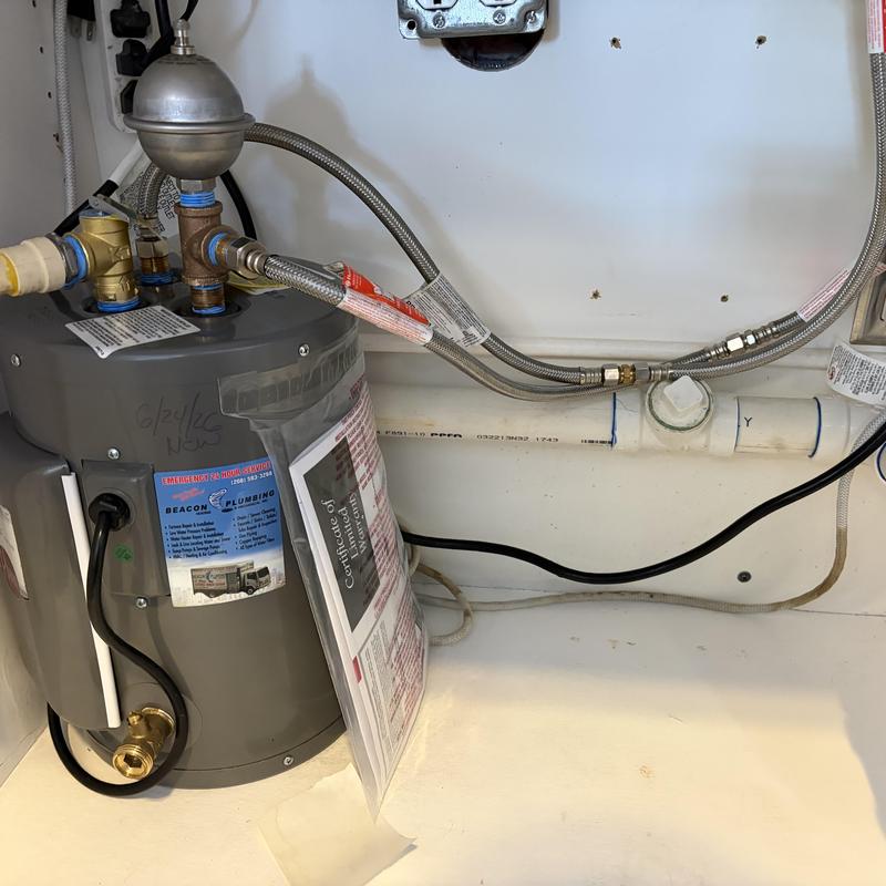 Point of use electric water heater with braided connections