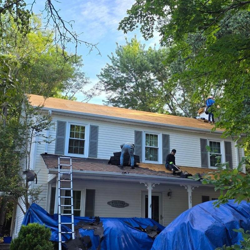 Roof decking replacement and shingle installation in progress