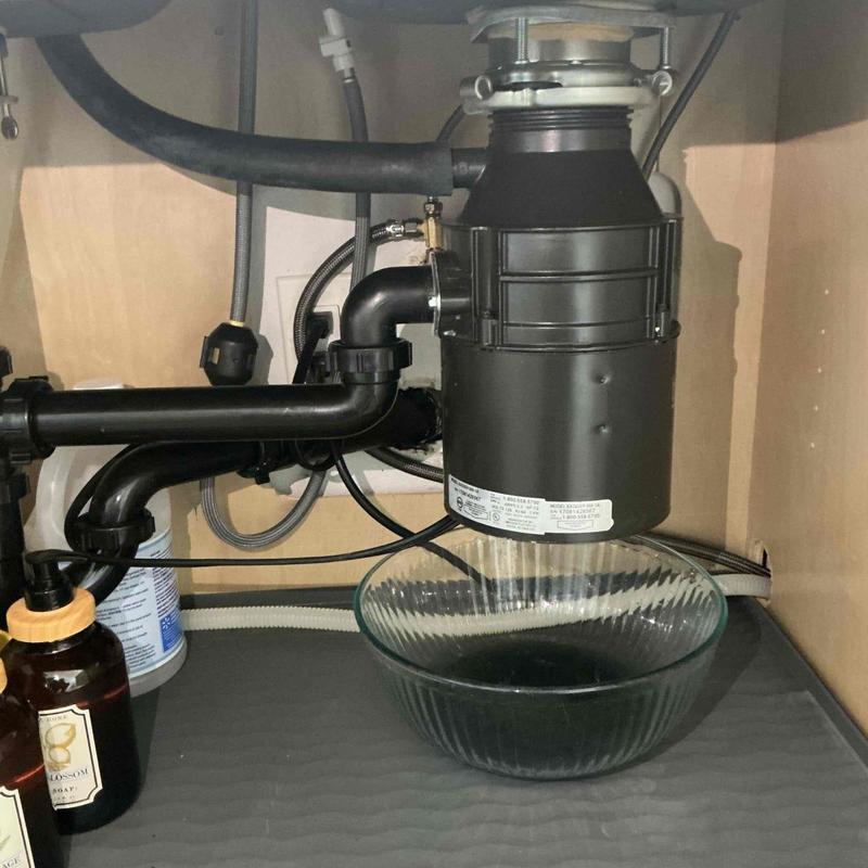 Garbage disposal unit under kitchen sink installation