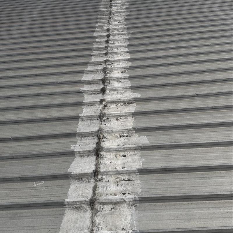 Silicone membrane roof seam with protective coating application Silicone membrane roof seam with protective coating application