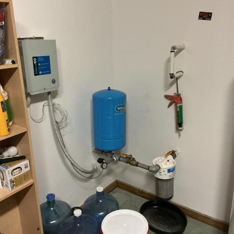Arsenic removal system with pressure tank and filter