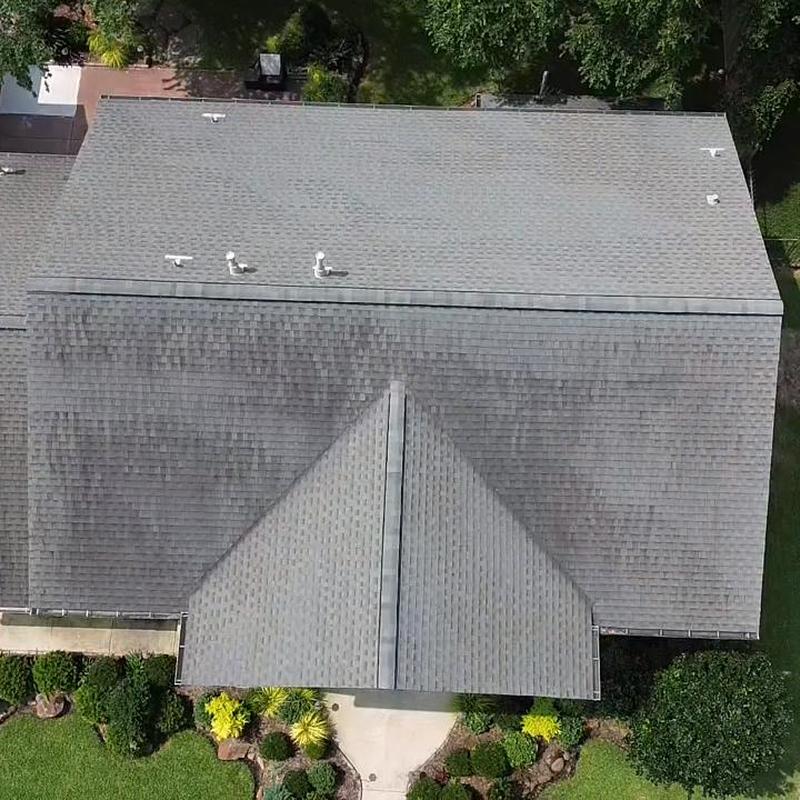 Asphalt shingle roof with ridge vent and vents