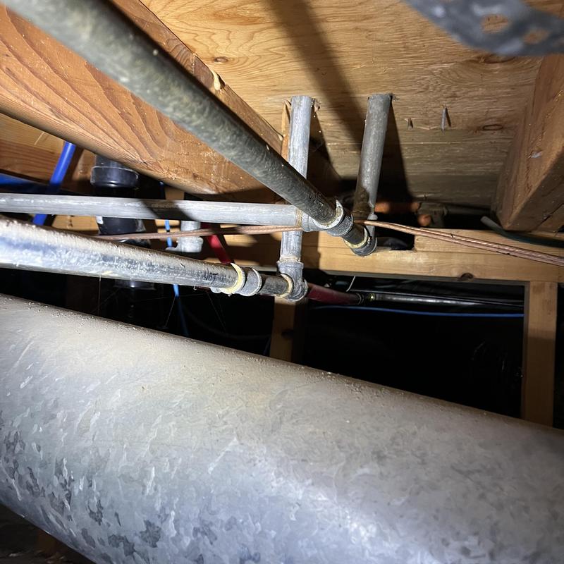 Galvanized piping removal near wooden joists under floor