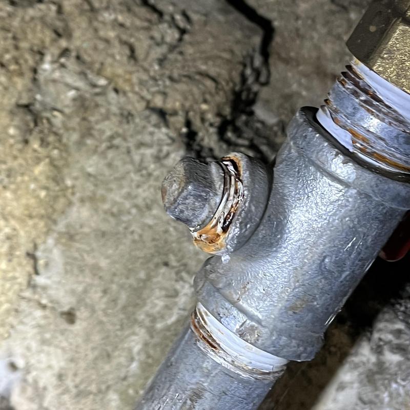 Galvanized pipe fitting with corrosion buildup
