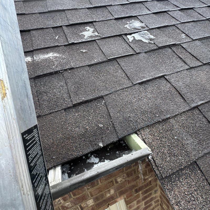 Asphalt shingles roof with hail damage and worn granules
