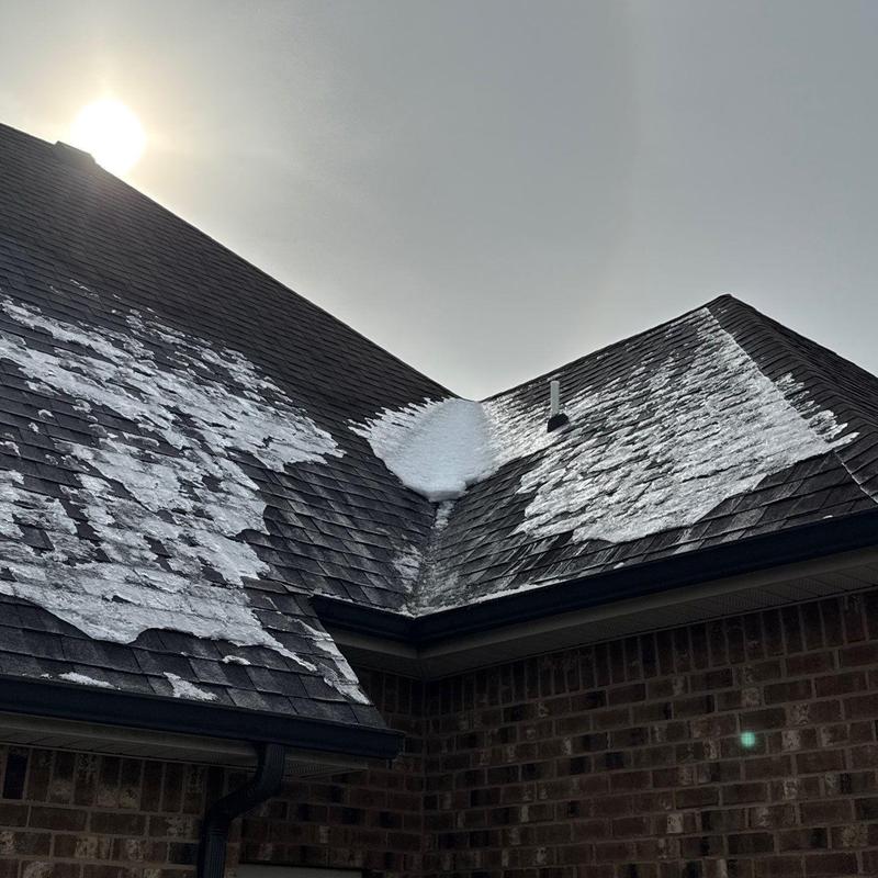 Asphalt shingles with hail damage and roof debris removal
