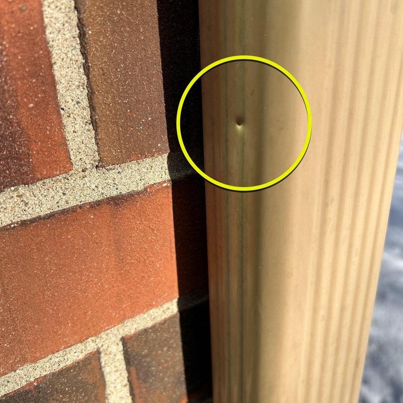 Downspout dent damage on residential gutter system