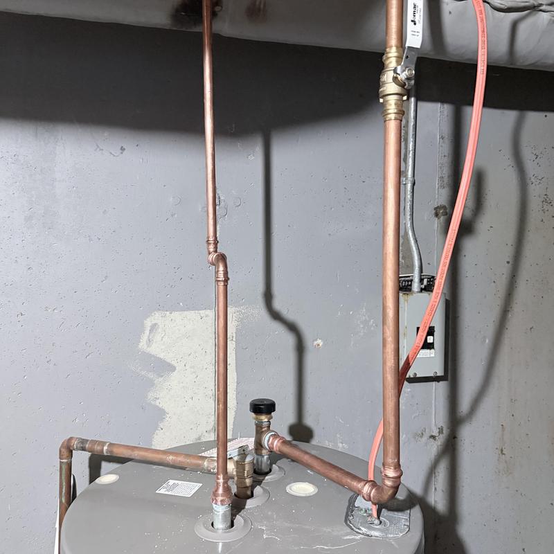 Copper plumbing pipes with new shutoff valve installation Copper plumbing pipes with new shutoff valve installation