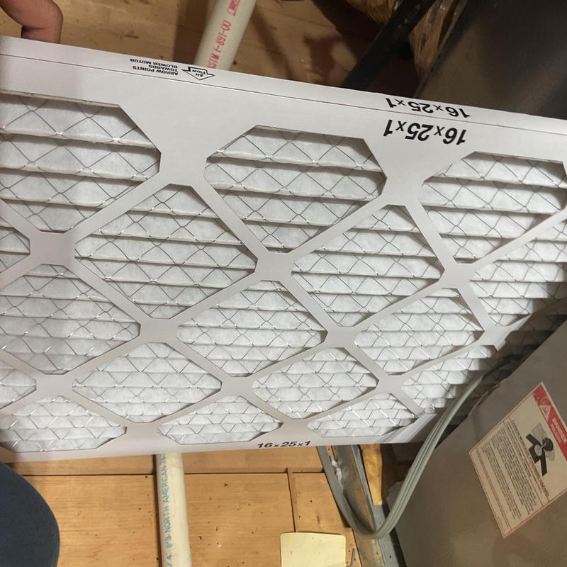Air conditioner filter replacement during HVAC maintenance