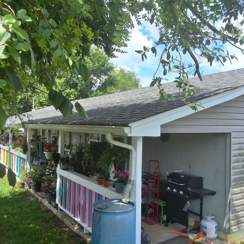 Shingles roof inspection on residential home exterior Shingles roof inspection on residential home exterior