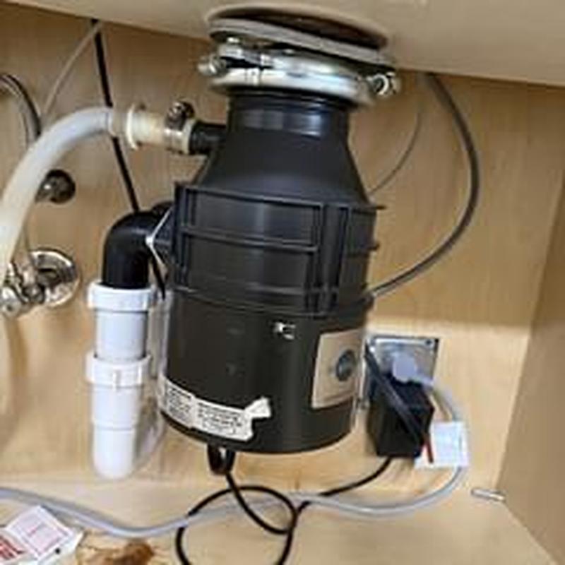 Garbage disposal unit replacement and drain clearing under sink