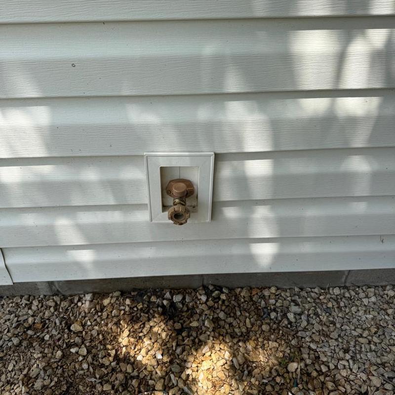 Frost free outdoor spigot on house siding