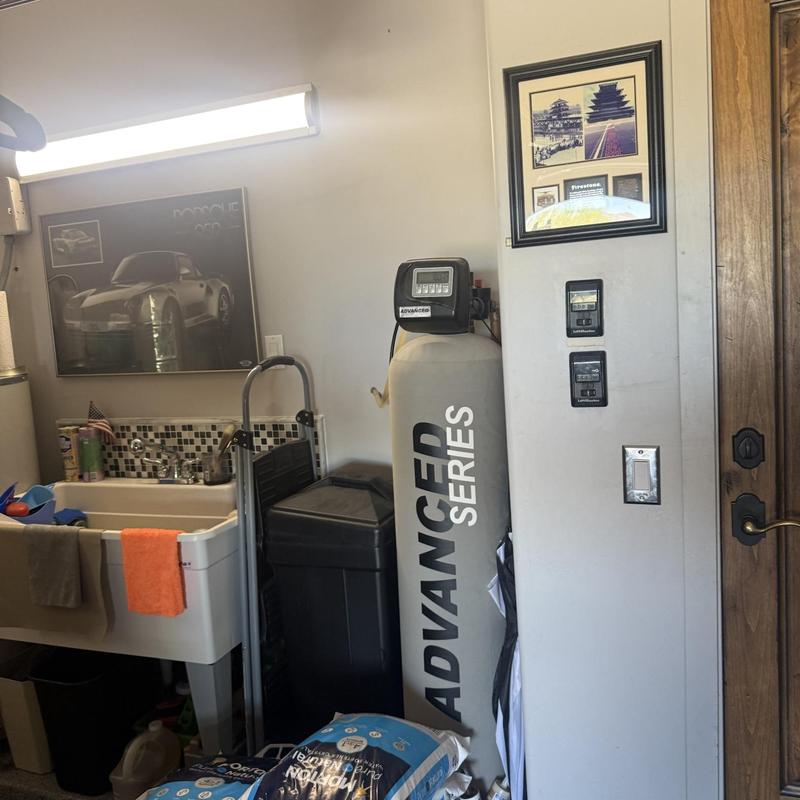 Water softener system with control valve and sink area