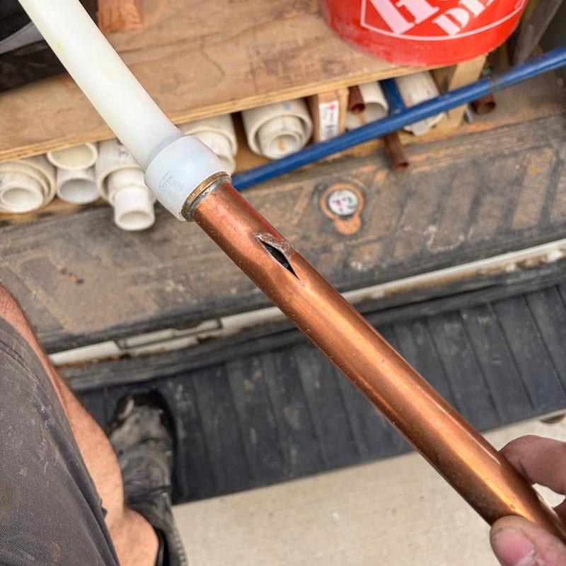 Copper pipe with split crack damage