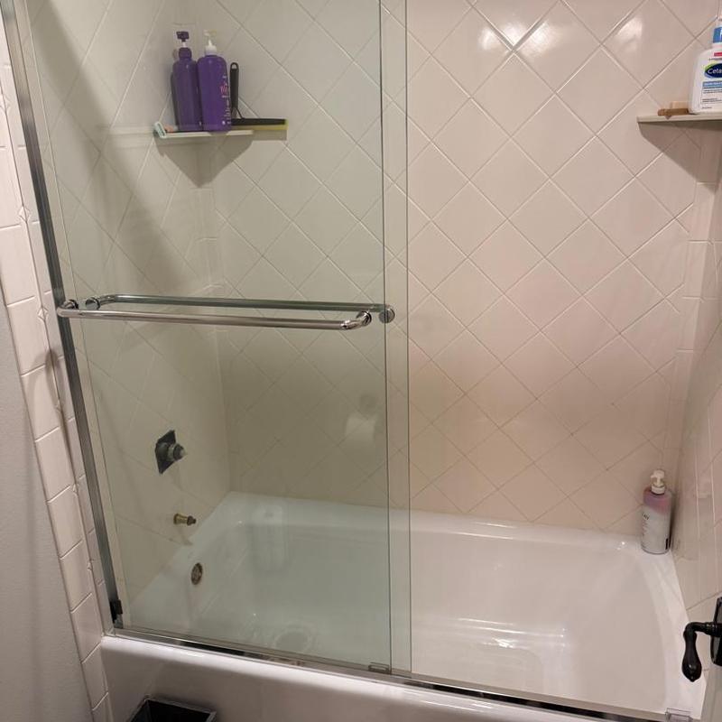 Shower fixtures removed from tiled bathroom shower
