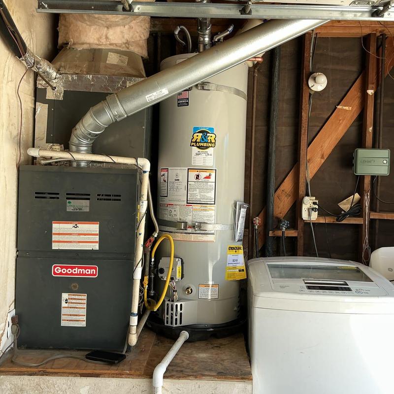 Water heater with gas line and sediment trap installation