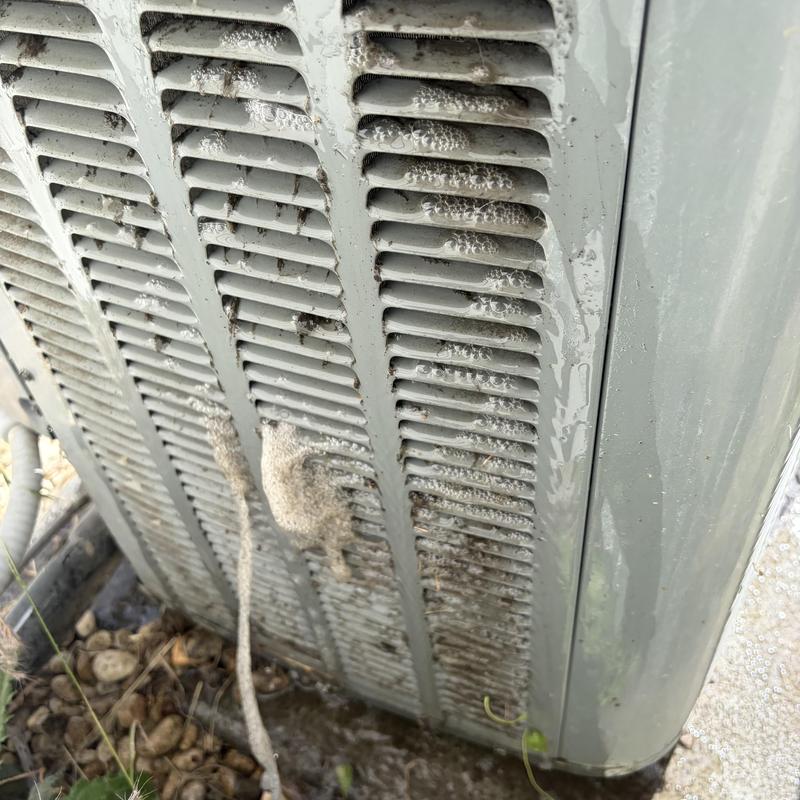 Air conditioner condenser coil with foam cleaning bubbles