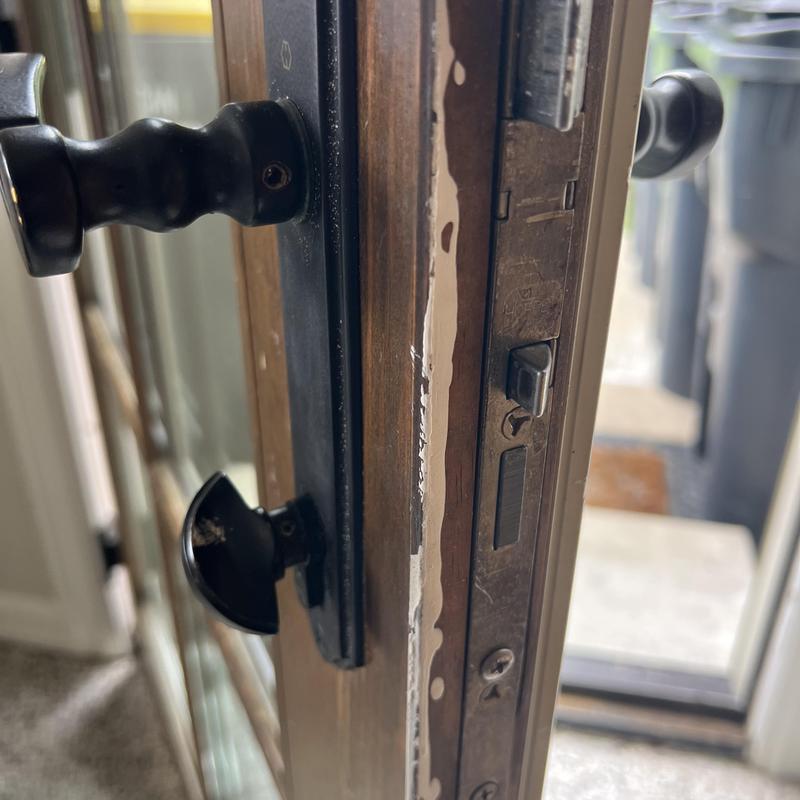 Deadbolt and door handle with lock rekeying in progress