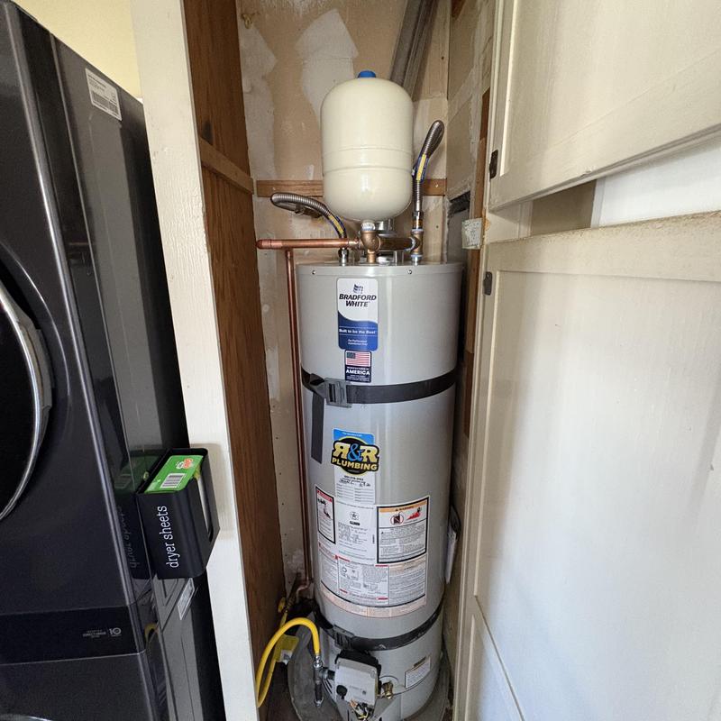 40-gallon gas water heater installation in utility closet