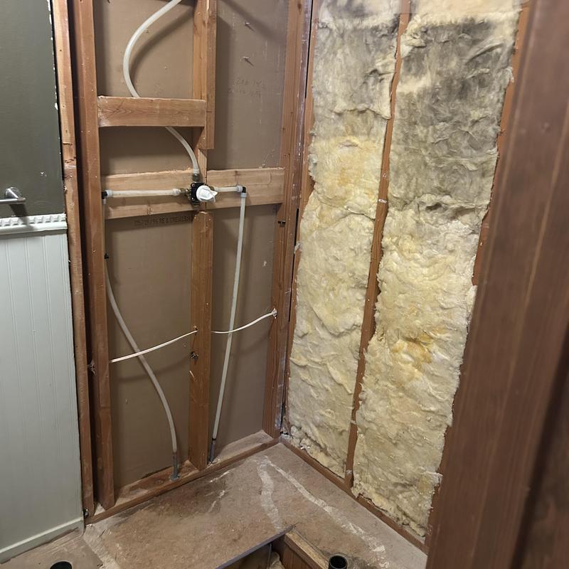 Shower valve and drain installation with P-trap relocation