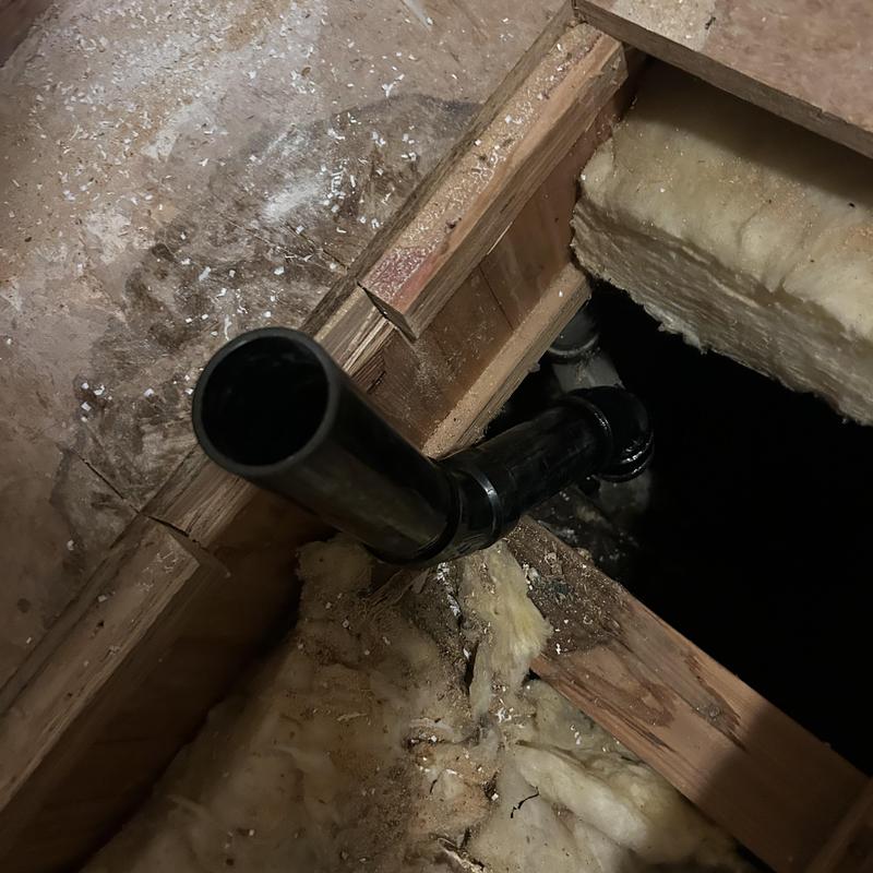 Shower drain pipe and P-trap installation in floor joist