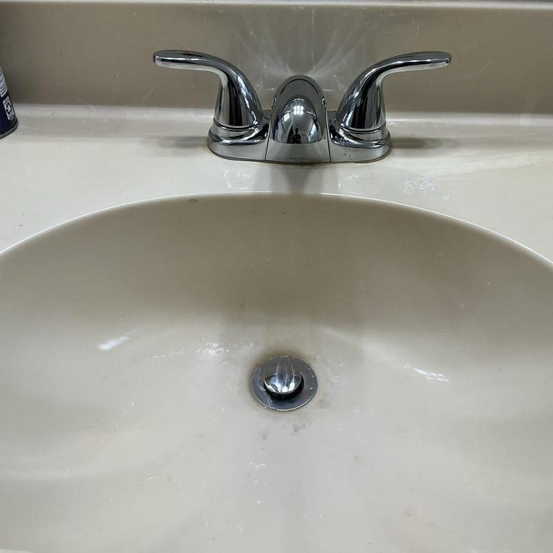 Bathroom faucet with pop-up drain installed