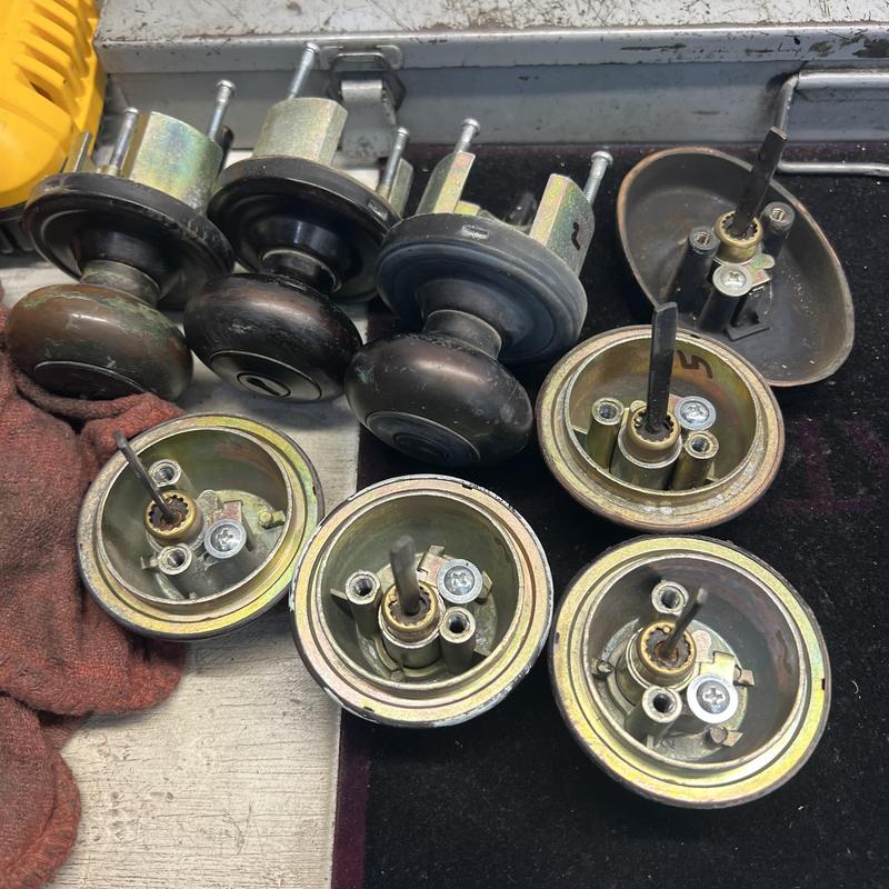 Door knob lock cylinders disassembled for rekeying