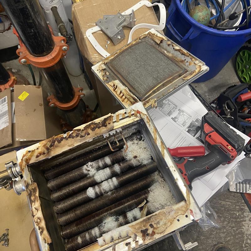 Tankless water heater heat exchanger with corrosion