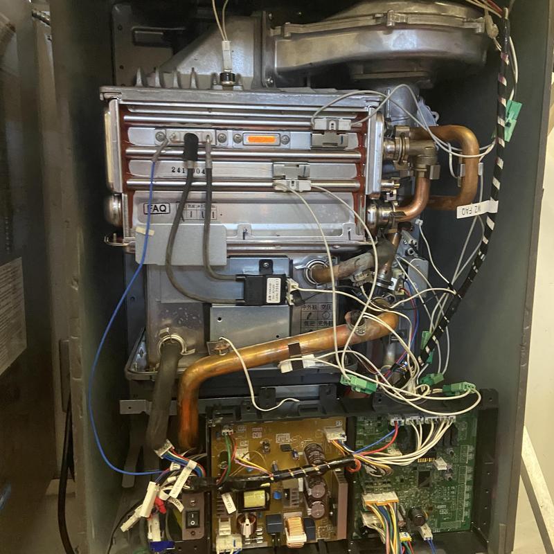Tankless water heater heat exchanger and wiring components