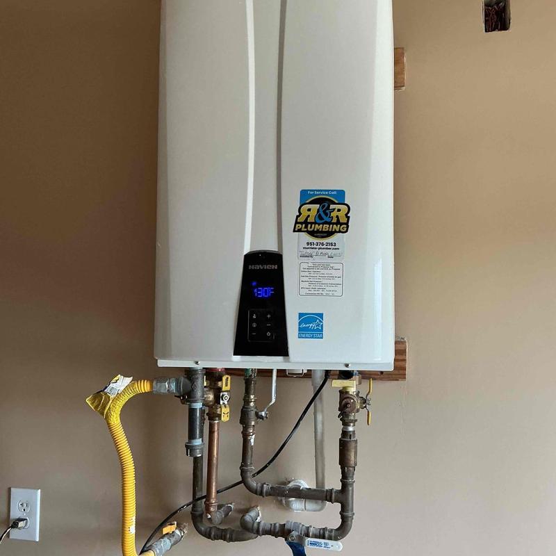 Tankless water heater flush and inspection with pipes