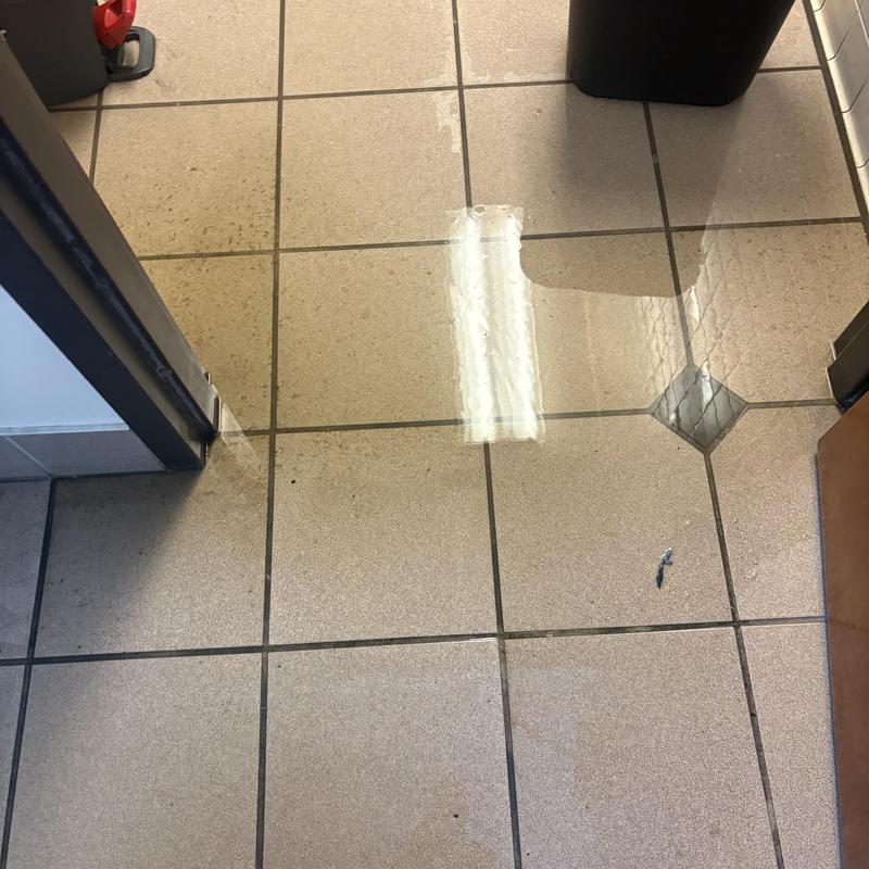 Commercial floor tile with replacement diamond tile insert