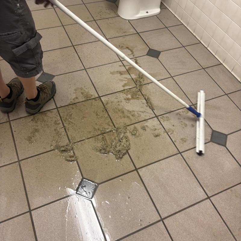 Commercial restroom floor cleaning after spill
